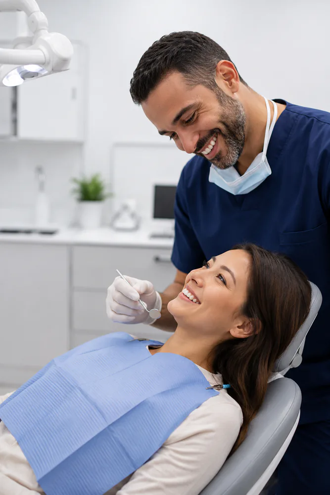 Dr. Cruz assessing a patient's mandibular range of motion and palpating the TMJ to differentiate a closed-lock from an open-lock presentation